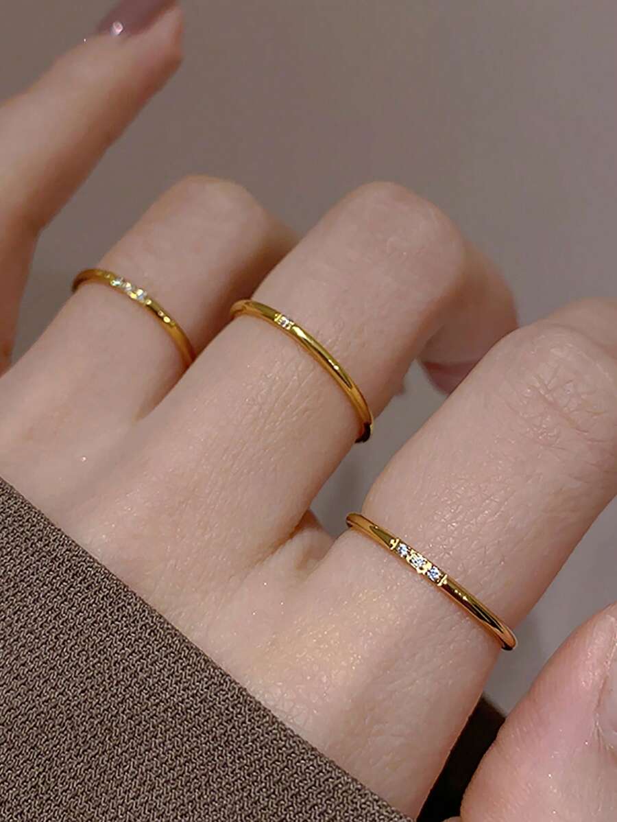Subtle Spark Set of 3 gold rings worn across three fingers