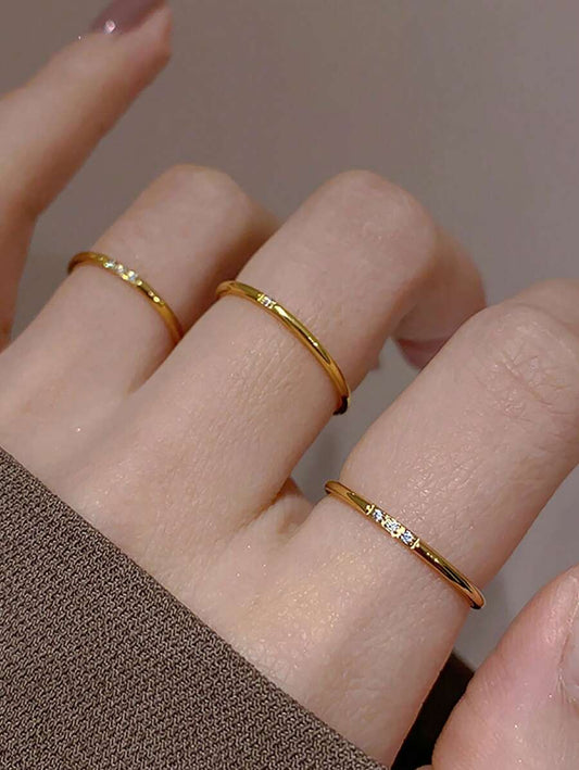 Subtle Spark Set of 3 gold rings worn across three fingers