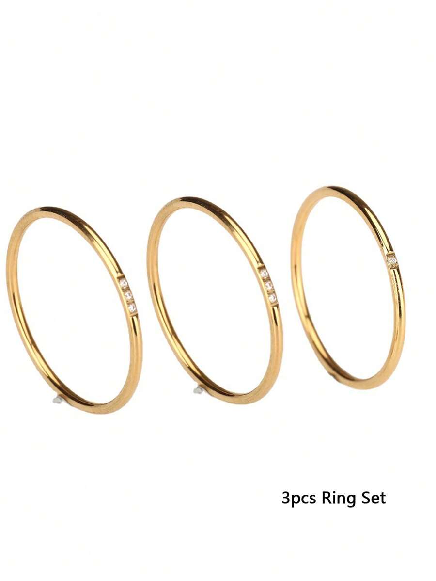 All three gold-tone rings in the Subtle Spark set