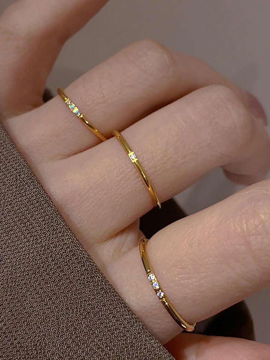 Subtle Spark rings styled on a hand, close-up view