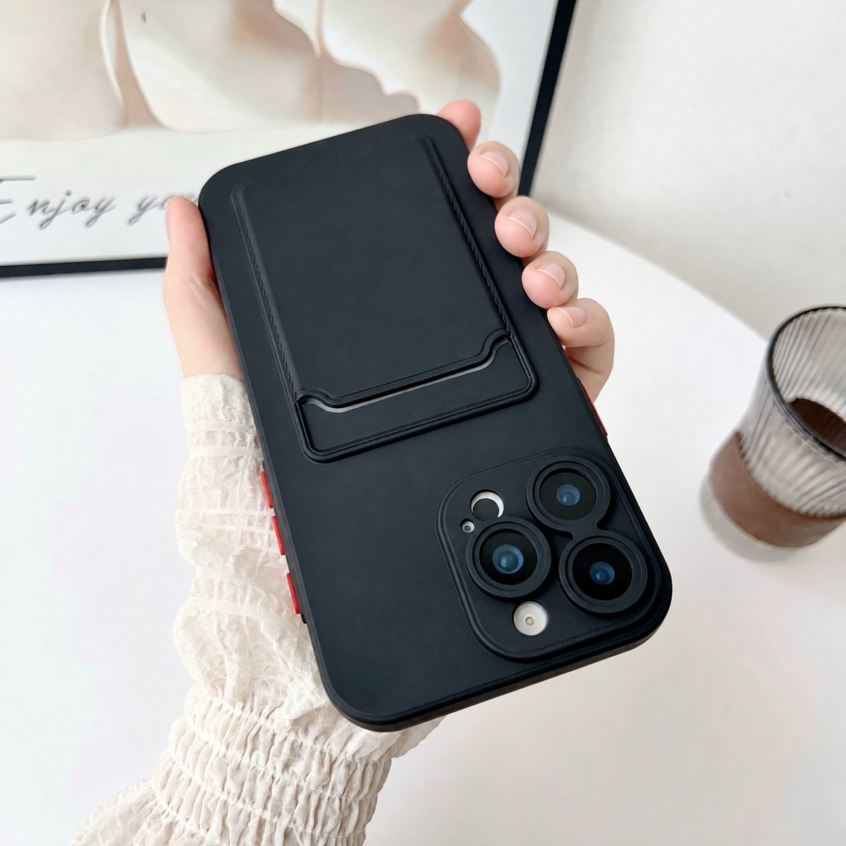 Black phone case held upside down showing the empty integrated card slot