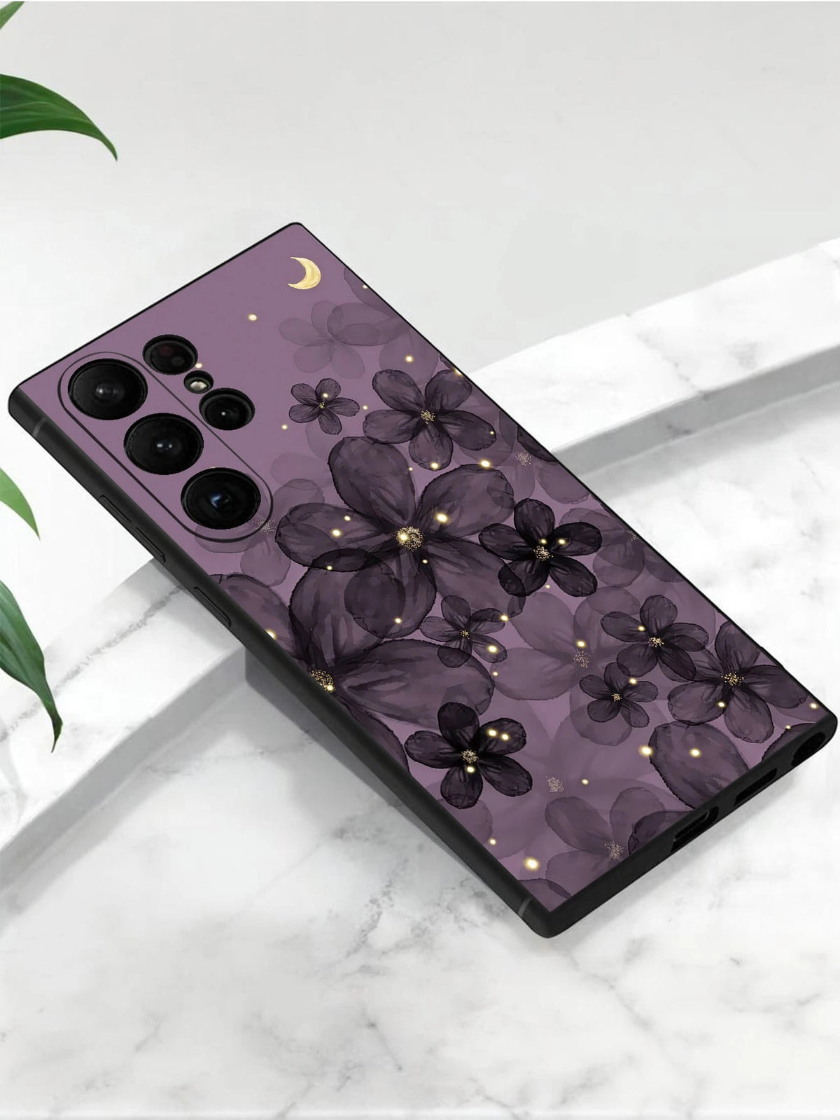 Purple floral moon phone case resting diagonally on a white ledge